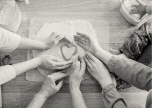 family making cookie dough with heart